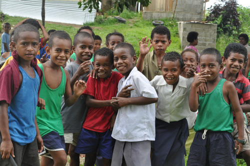 group of children smiling at the camera