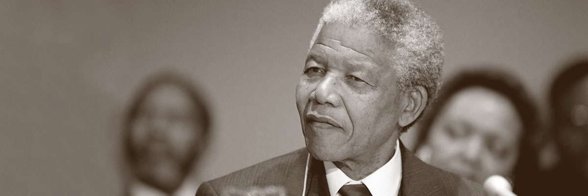 Nelson Mandela, President of the African National Congress, addresses a press conference where he called for a 'phased maintenance' of sanctions. 03 December 1991. Copyright UN Photo/John Isaac