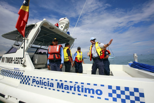 Members of the UN Police's Maritime Policing Unit give tips to their colleagues from the Polícia Nacional de Timor-Leste aboard a boat off the nation’s coast, 2010. UN Photo/Martine Perret