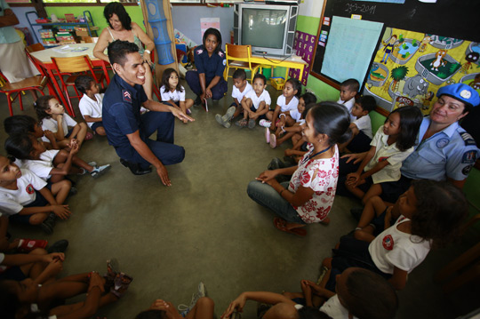 UN and Timorese police officers provide a safety briefing for school children in Dili, the nation’s capital, 2011.  UN Photo/Martine Perret