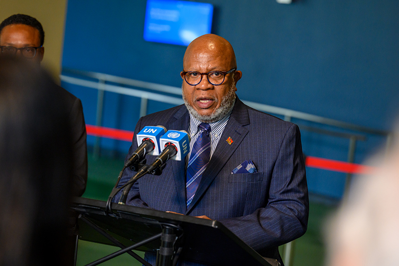 Dennis Francis speaking at a podium