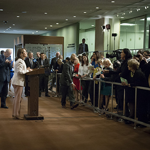 Ségolène Royal (at lectern), Minister of the Environment, Energy and Marine Affairs of France, responsible for International Climate Relations, and President of COP21, speaks to journalists following her meeting with Secretary-General Ban Ki-moon. UN Photo/Loey Felipe