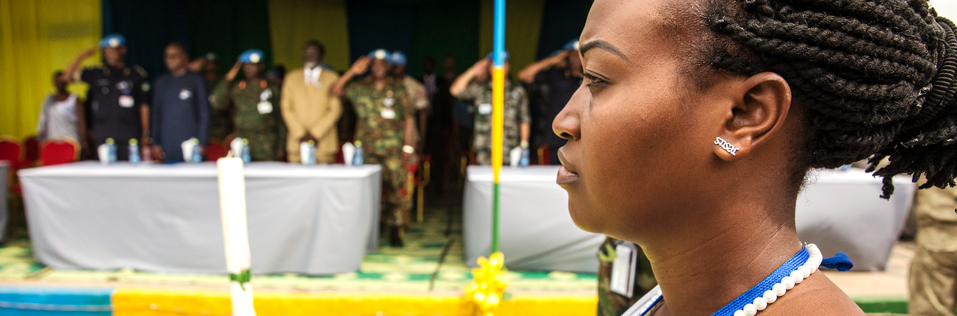 Participants standing in honor of the Rwanda genocide victims and pledging to fight genocide ideology