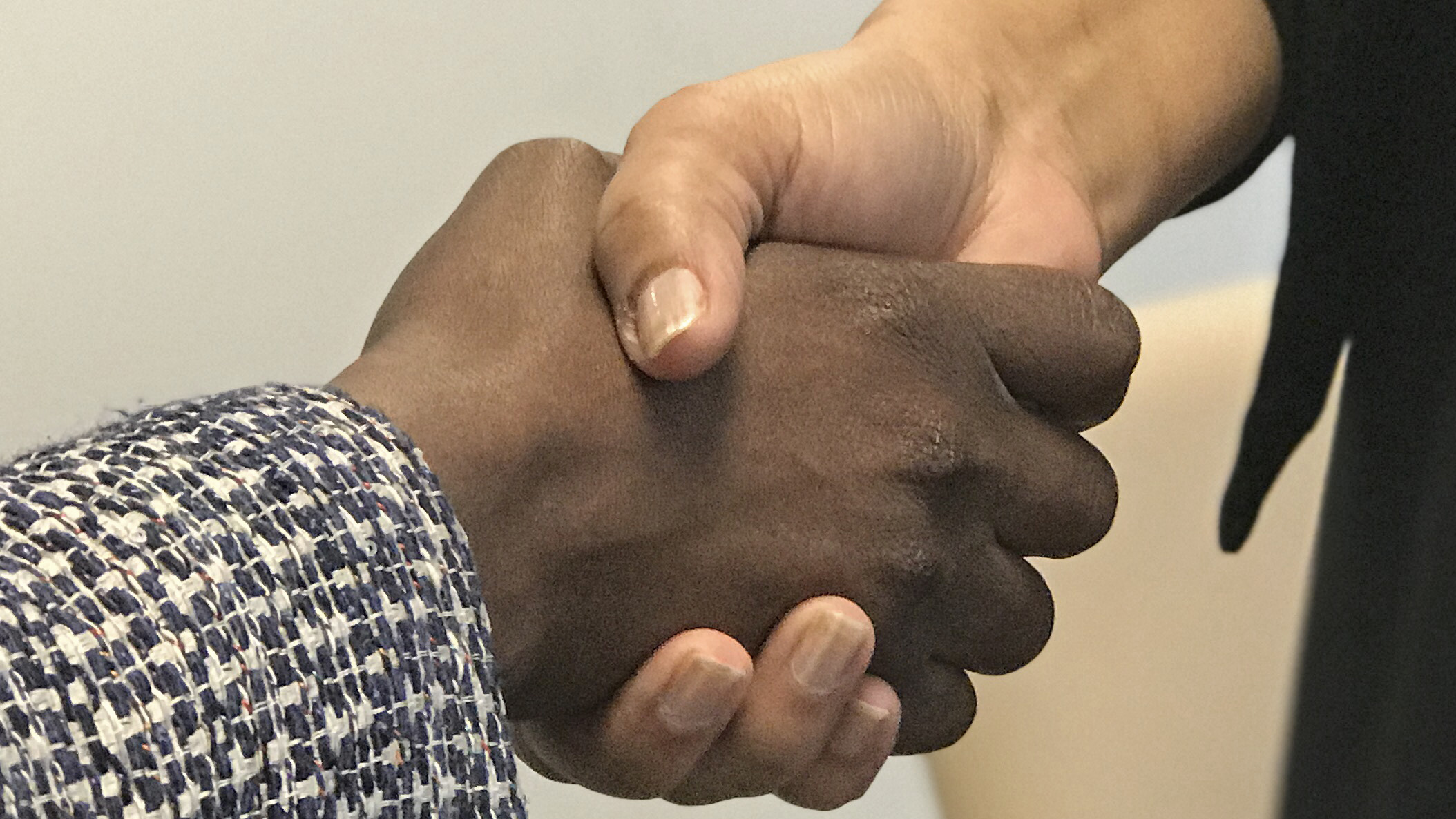 Photo of two hands shaking
