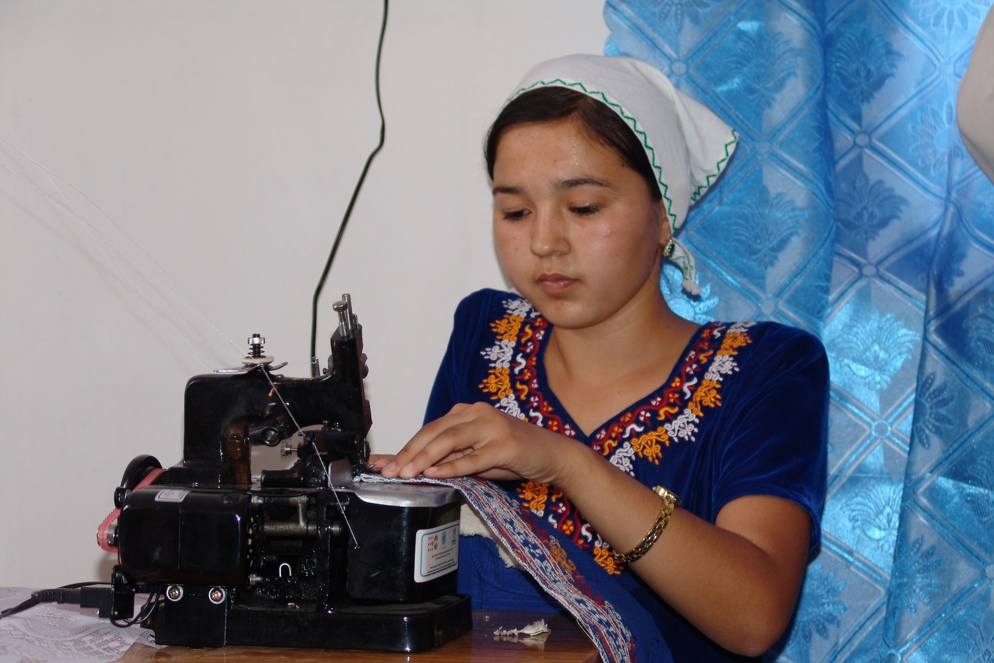 Turkmenistan - A young Tajik refugee learns sewing skills to boost her income and to enable her to participate in the local community.