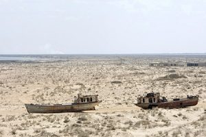 Uzbekistan-programme-page-photo-1 A view of rusted, abandoned ships in Muynak, Uzebkistan, a former port city whose population has declined precipitously with the rapid recession of the Aral Sea. UN Photo/Eskinder Debebe