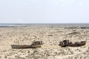 A view of rusted, abandoned ships in Muynak, Uzebkistan, a former port city whose population has declined precipitously with the rapid recession of the Aral Sea. UN Photo/Eskinder Debebe