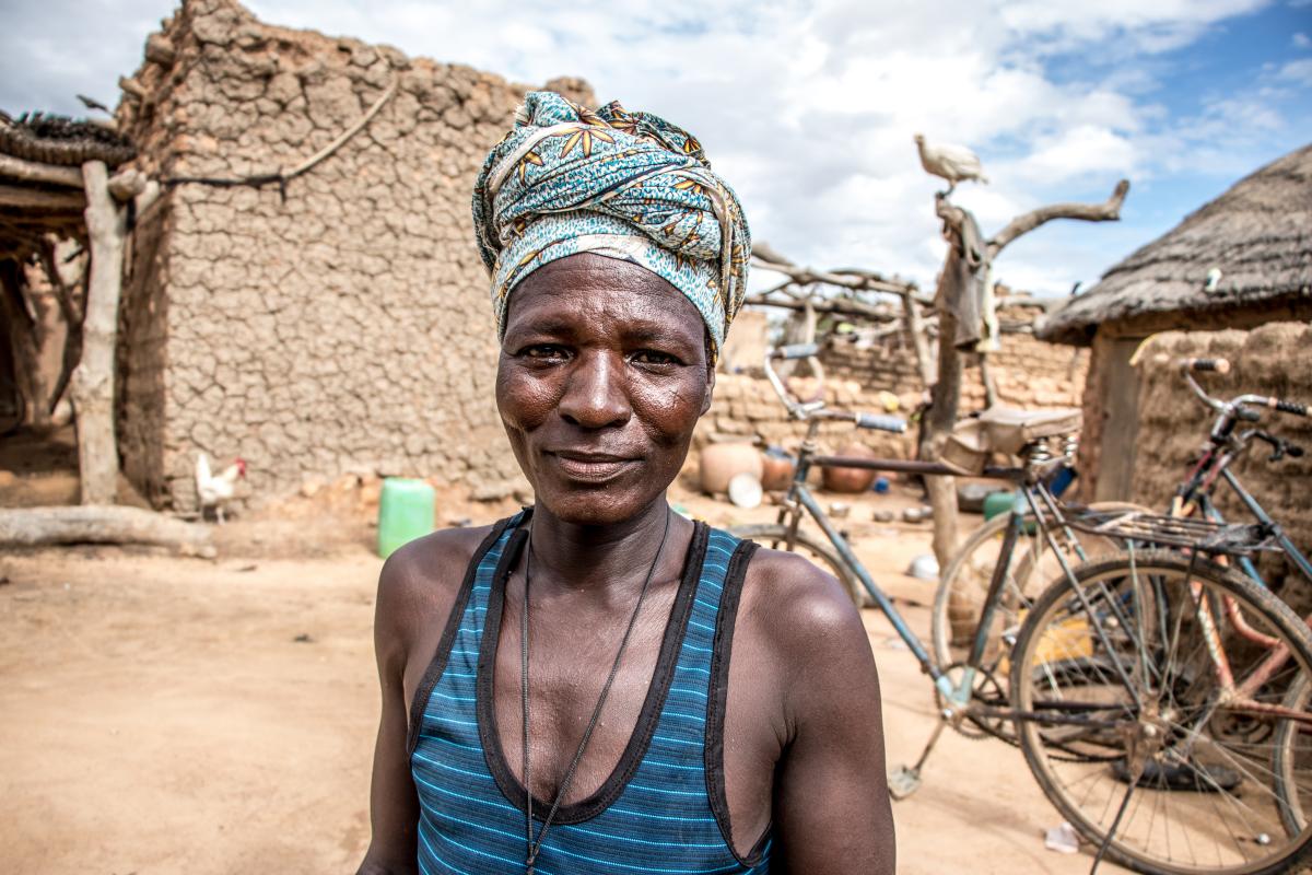 Burkina Faso: Portrait of Ninigeté sitting outside her house