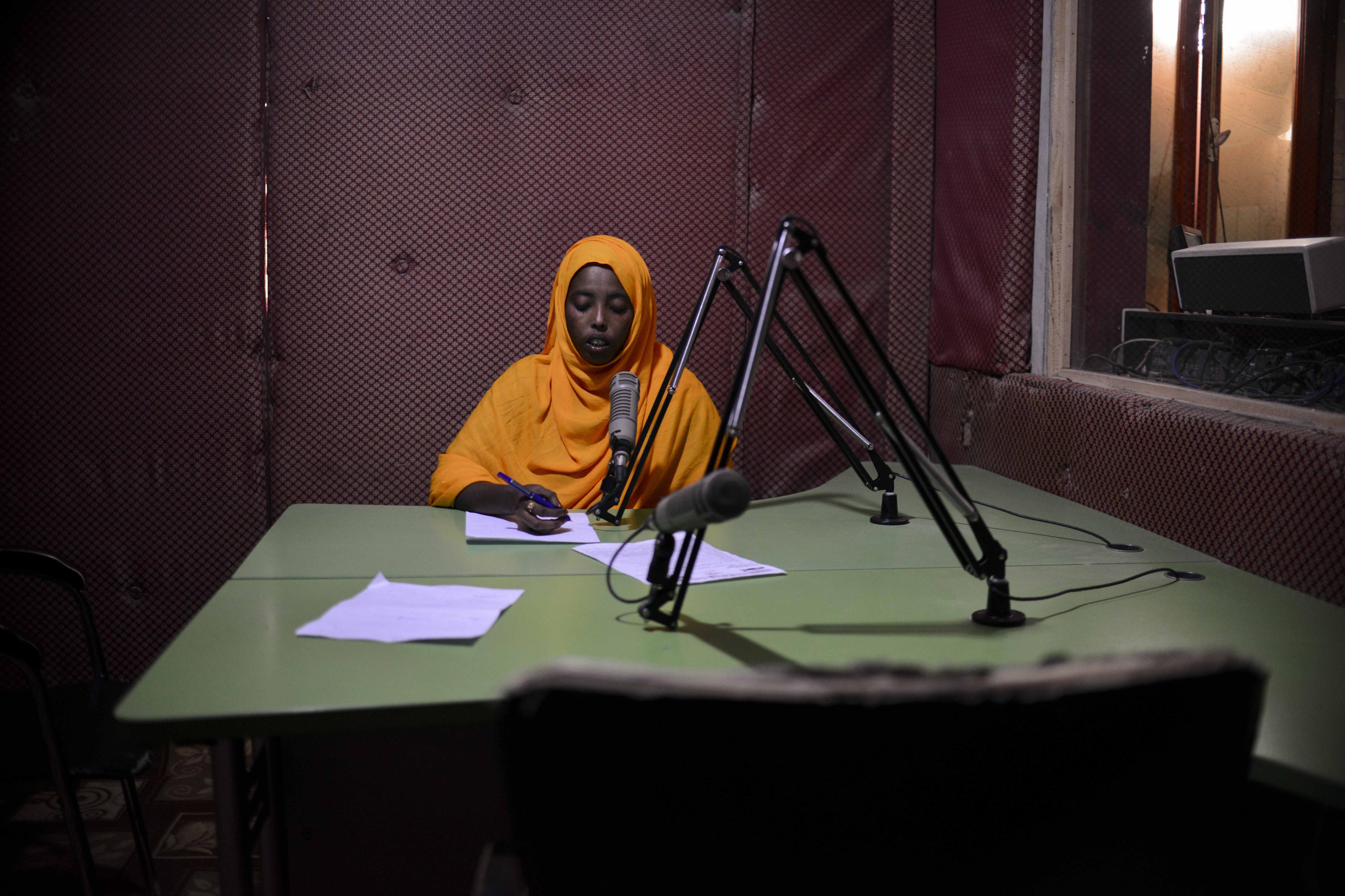 A presenter reads the news at Radio Shabelle, Mogadishu, Somalia.
