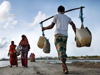 photograph of people carrying water bottles