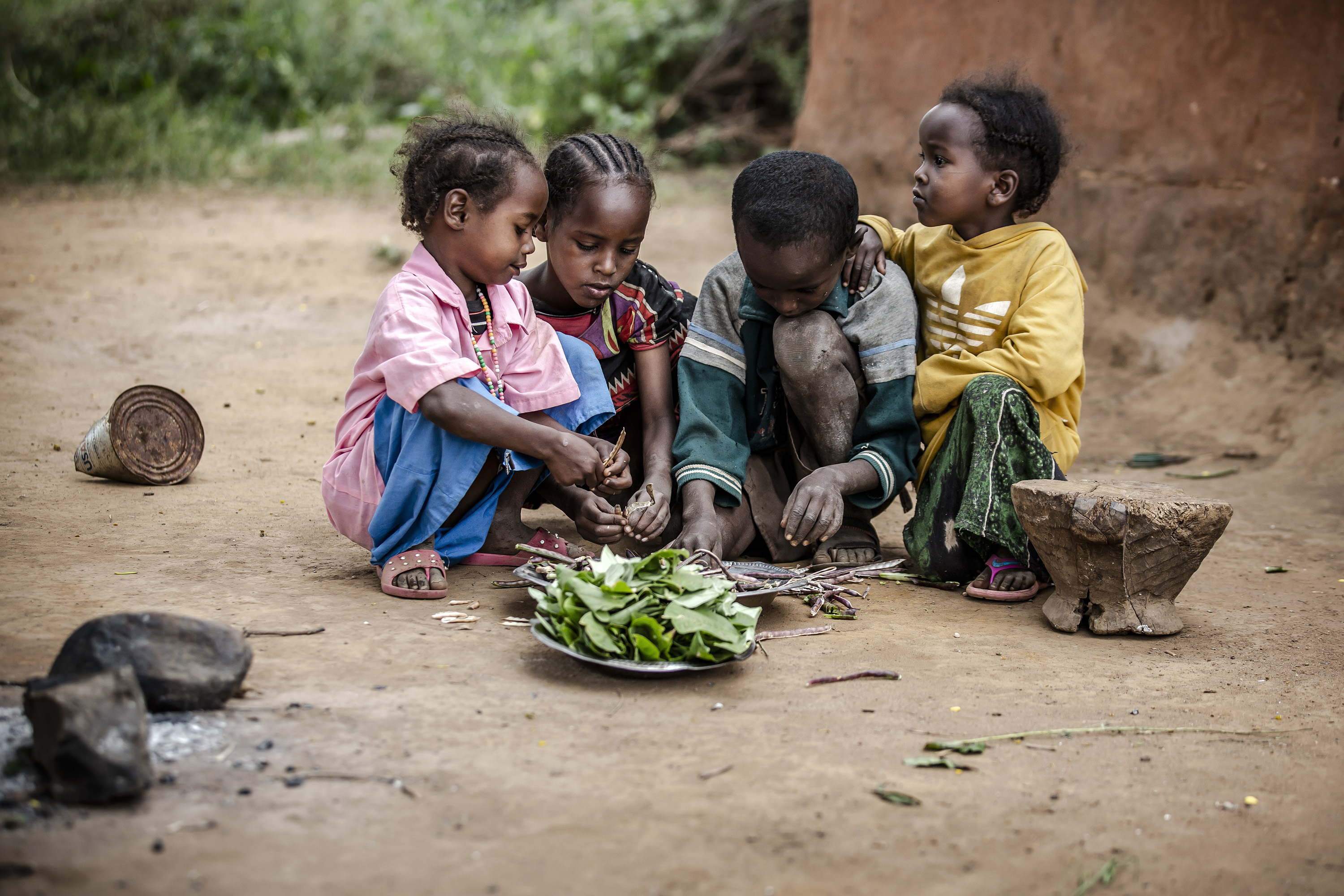 Children preparing cowpeas in Moyale, Kenya.