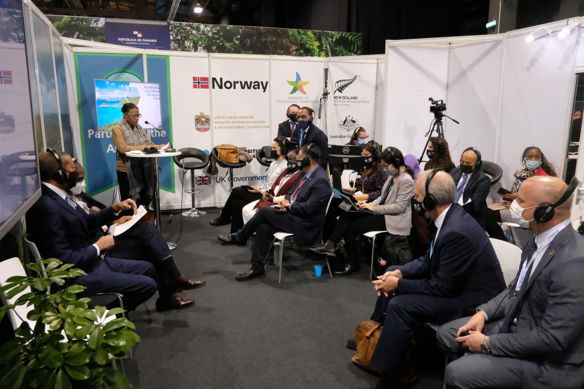 Representatives from island nations and development partners discuss debt for climate swaps at COP26, Glasgow