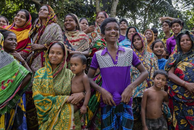 Residents visit the school in Kashadaha village, Bangladesh.