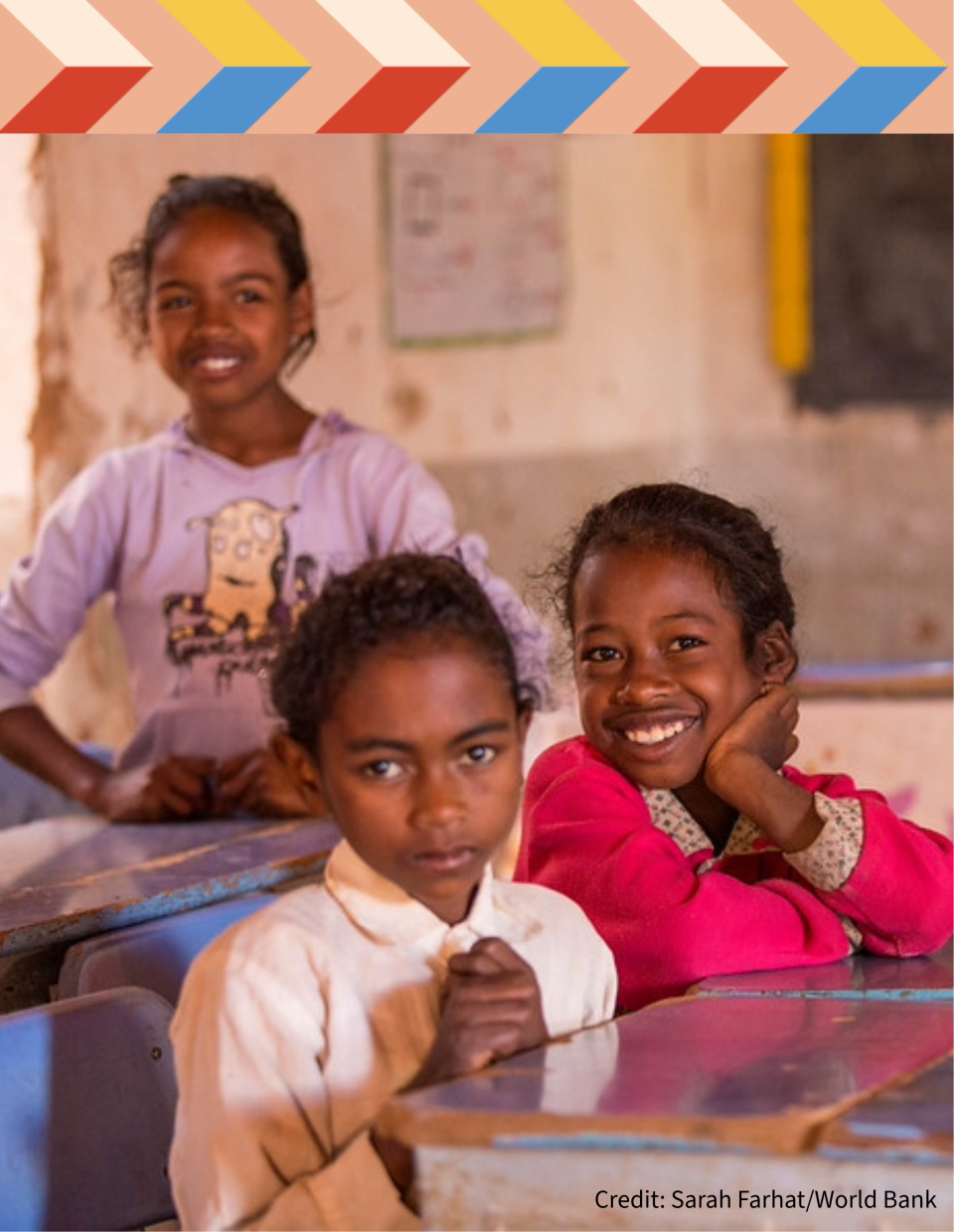 Three smiling girls at the school