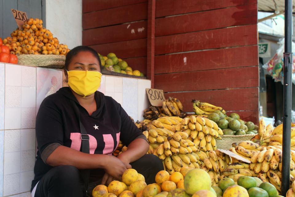 The picture seller use a protective mask to sell their merchandise in Madagascar.
