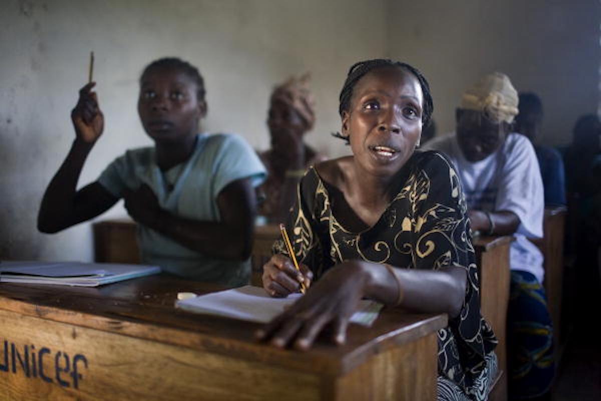 Liberian women attend math and literacy class.