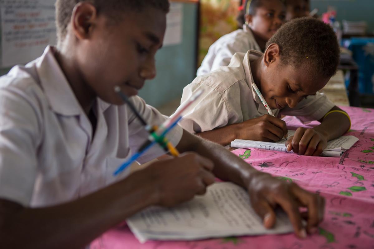 Third grade students mastering literacy skills and acquiring new concepts during class at Norsup Primary School, Vanuatu. 