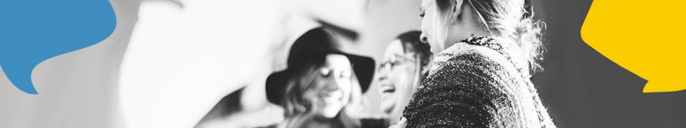 three happy women, talking with one another