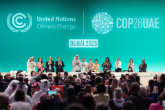 COP28 President and other participants onstage during the Closing Plenary