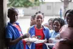 Students receive and eat their daily hot meals