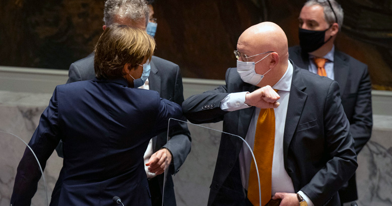 Vassily Nebenzia, Permanent Representative of the Russian Federation and President of the Security Council for the month of October, greets Nicolas De Rivière, Permanent Representative of France to the United Nations, ahead of the Security Council meeting concerning Haiti.