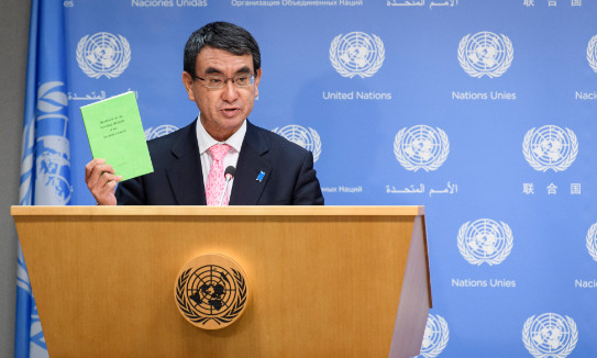 Taro Kono, Minister for Foreign Affairs of Japan and President of the Security Council for the month of December, stands at a podium and briefs journalists on the working methods of the Security Council.