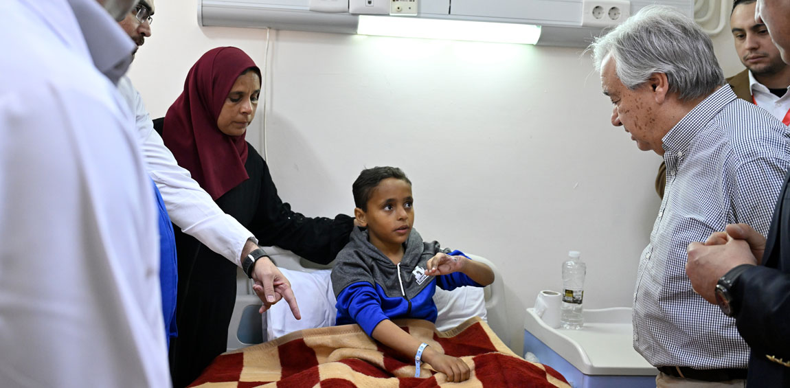 Secretary-General António Guterres (right) visits with Palestinian civilians from Gaza and their families at the General Hospital in Al-Arish, Egypt, injured during the ongoing conflict. UN Photo/Mark Garten