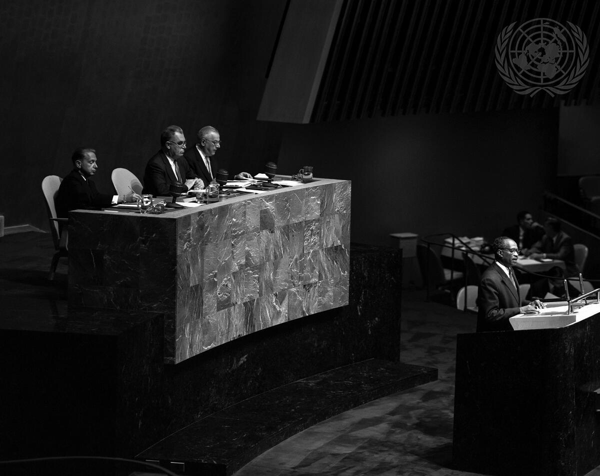 View of the General Assembly podium with UN Secretary-General Dag Hammarskjold (left), Sir Leslie Munro, President of the 12th session of the General Assembly (center), and Mr. Andrew Cordier, Executive Assistant to the Secretary-General (right).