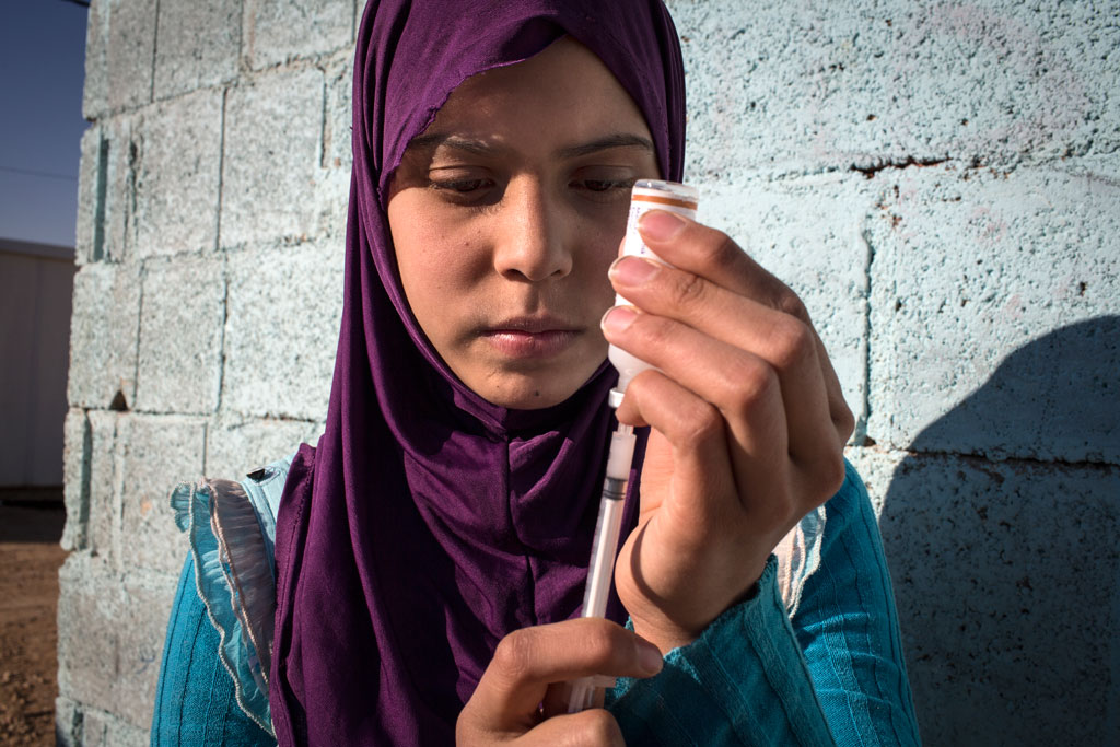 girl with insulin syringe