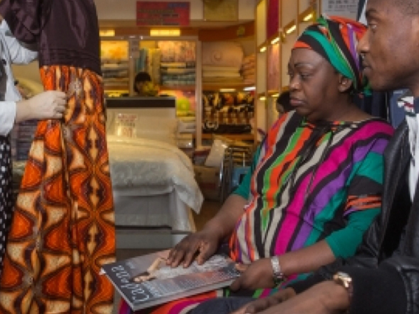 Traders from Africa buying goods in Xiaobei, China. Photo: Gwenn Dubourthoumieu