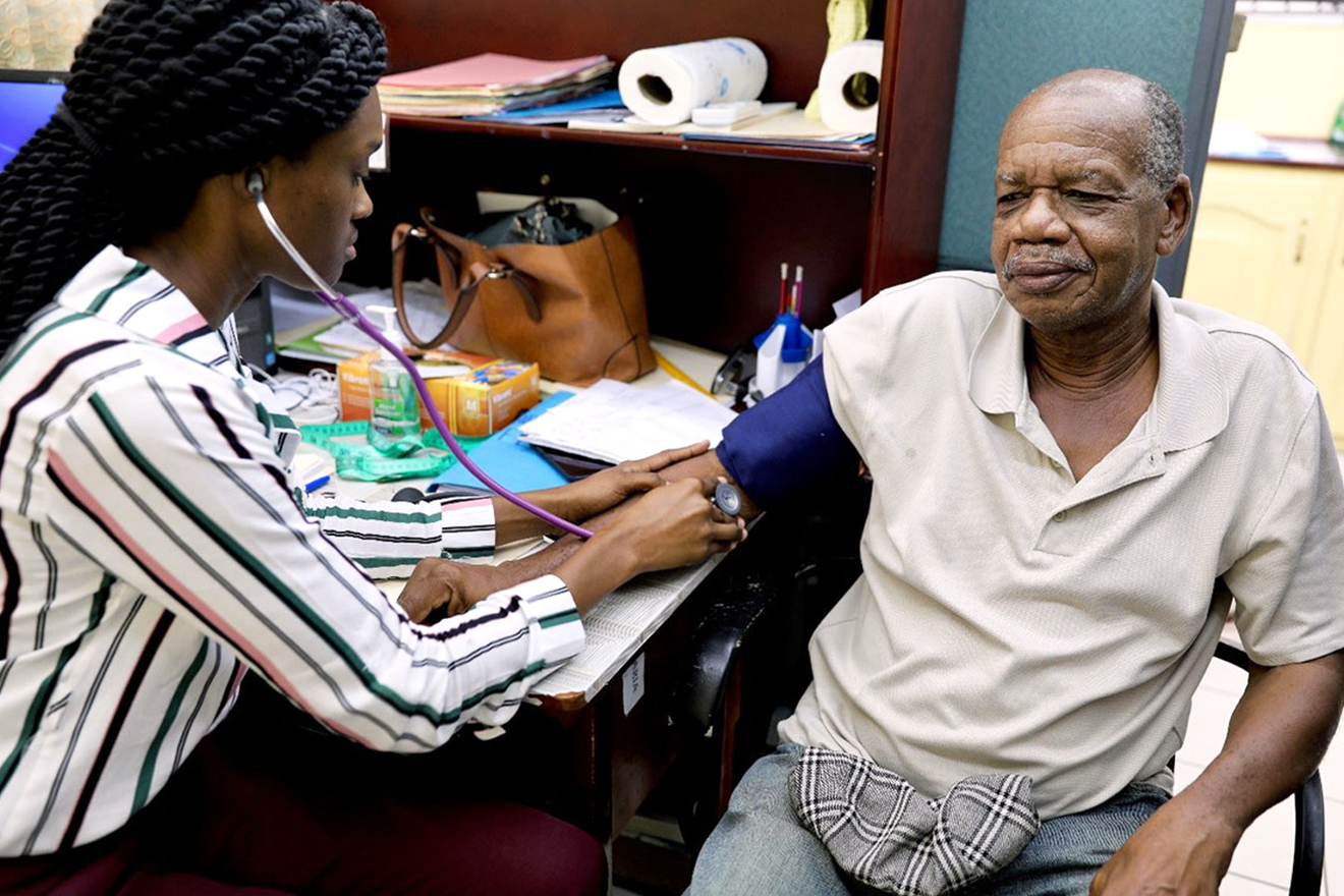 Monty-Gaskin has his blood pressure examined by a health practitioner in a hospital setting.