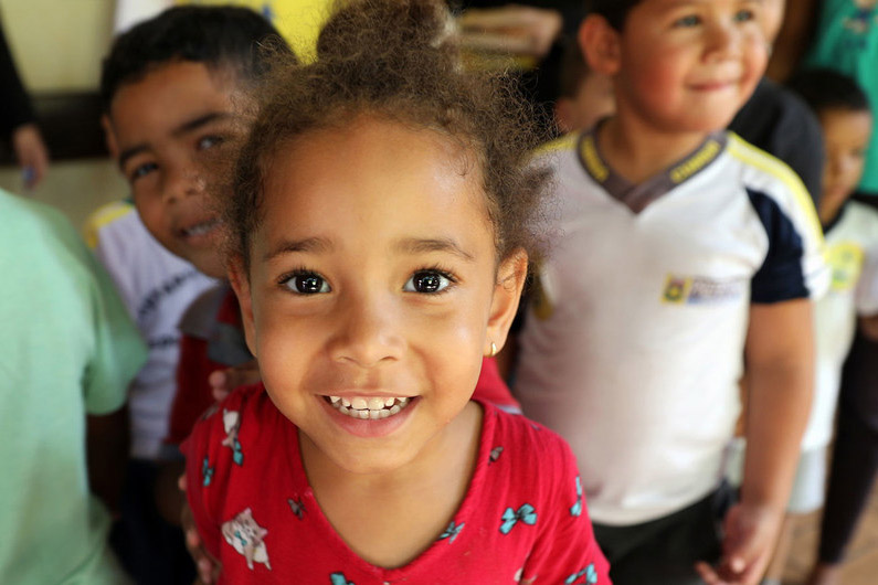 children waiting for vaccinations