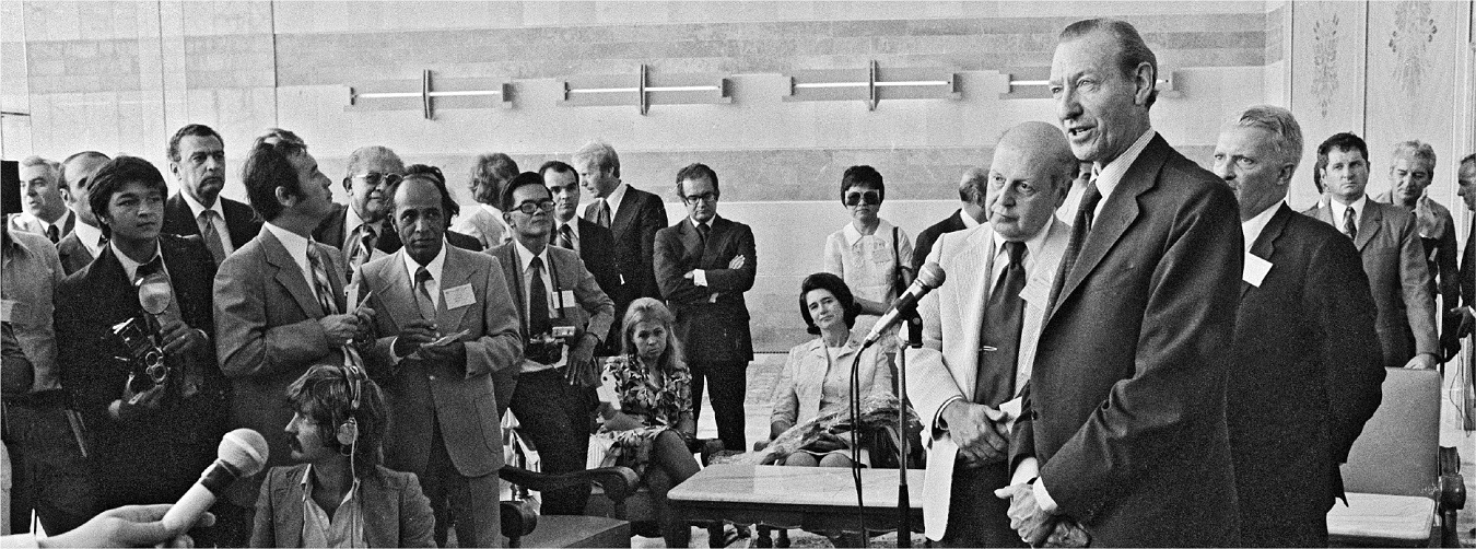 Secretary General Kurt Waldheim holds a press conference in the VIP room at Otopeni airport in Romania.