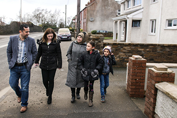 Syrian refugee Maisaa and her two children are shown around the town of Armagh, Northern Ireland. 
