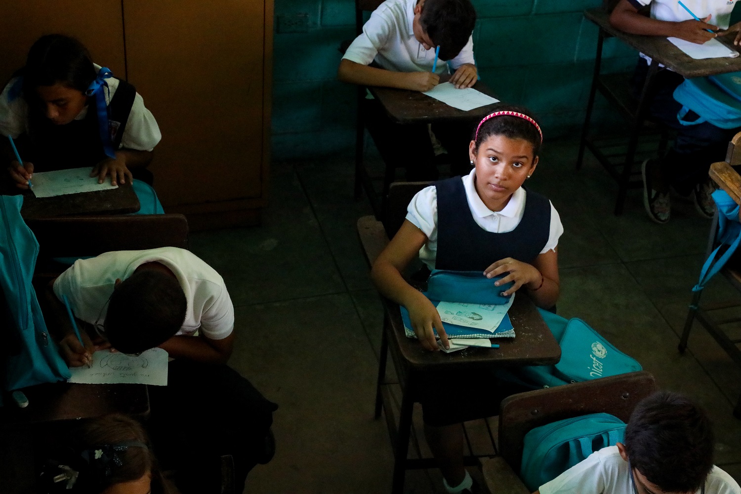Valeria, 10, goes to a UNICEF-supported school in Maracaibo, Venezuela, where power shortages have forced teachers to shorten the school day.