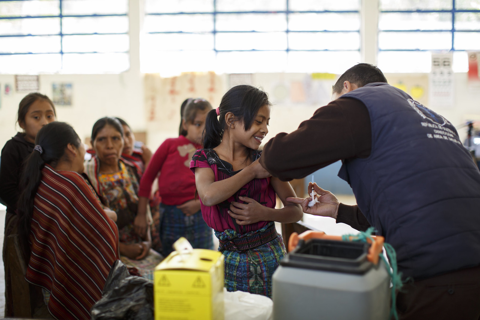 A girls prepared for vaccination 