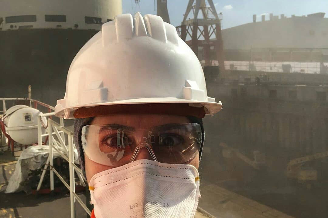 woman seafarer wearing protective mask