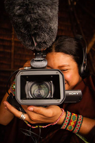 Woman with a camera and microphone