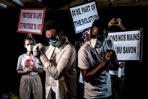 Hip hop artists wearing face masks.