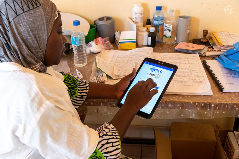 woman accessing health care resources on tablet