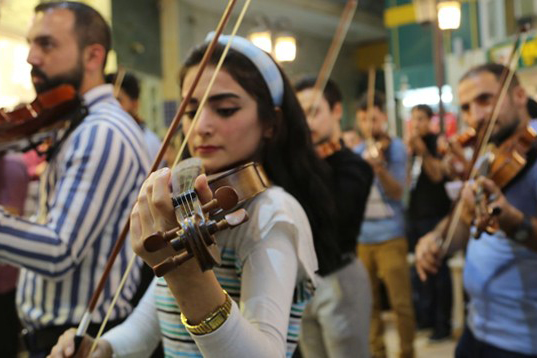 Like many talented young people from Mosul, Rawnaq is paving a new way forward for her city.  violinists