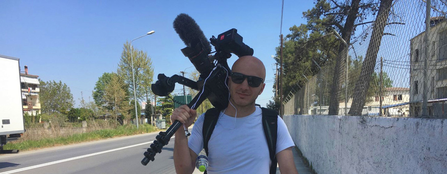 Hassan Akkad carrying a camera