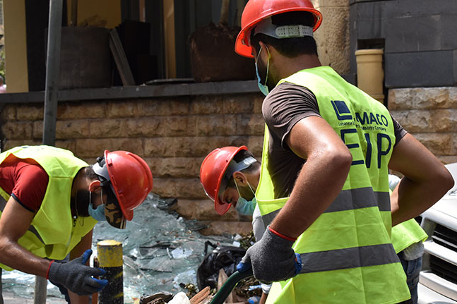 workers clearing debris