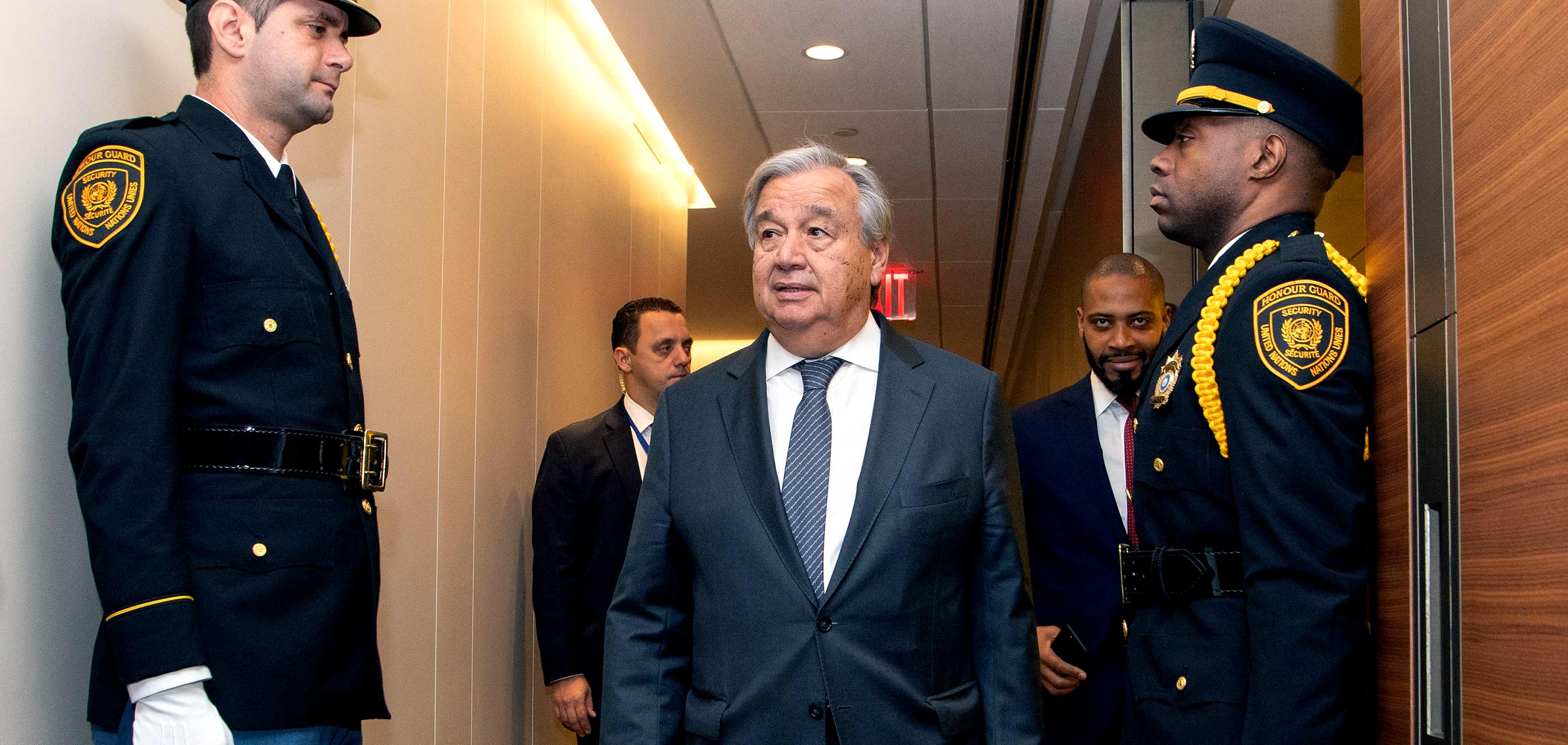 Secretary-General António Guterres, protected by UN Security Service Officers, is on his way to the General Assembly Hall during the General Assembly's seventy-fourth general debate.