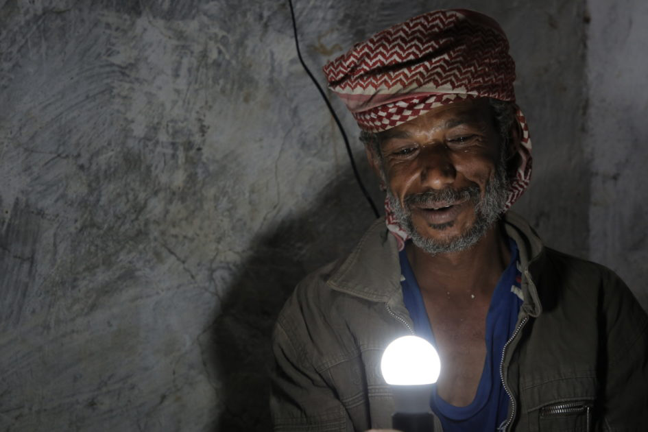 man holding lightbulb