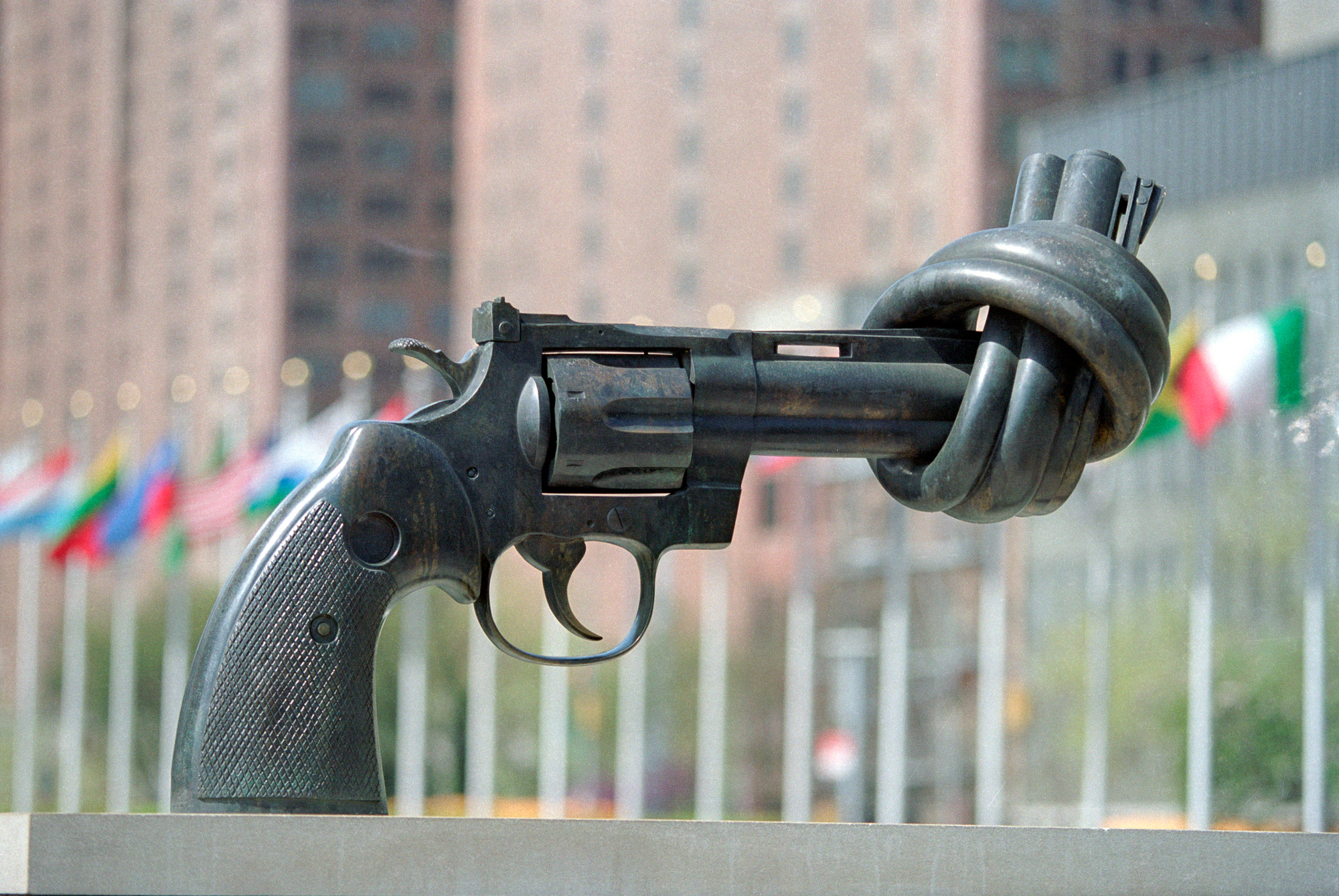 Sculpture of a gun with a knot on the barrel. 