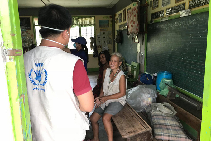 typhoon survivors and WFP staff