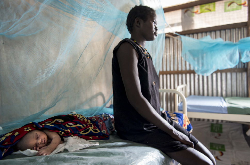 Nyagai Jany, age 17, gives birth to her first child, a baby girl, in the maternity clinic in the Bentiu Protection of Civilians (POC) Camp.