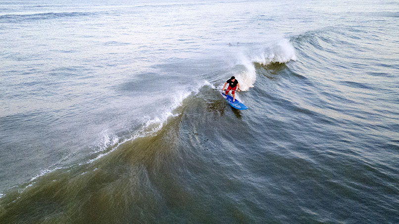 drone shot of Richard Ragan surfing 