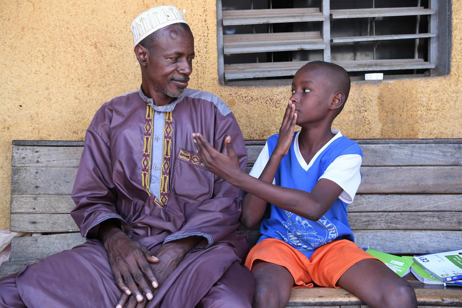 father and son converse in sign language